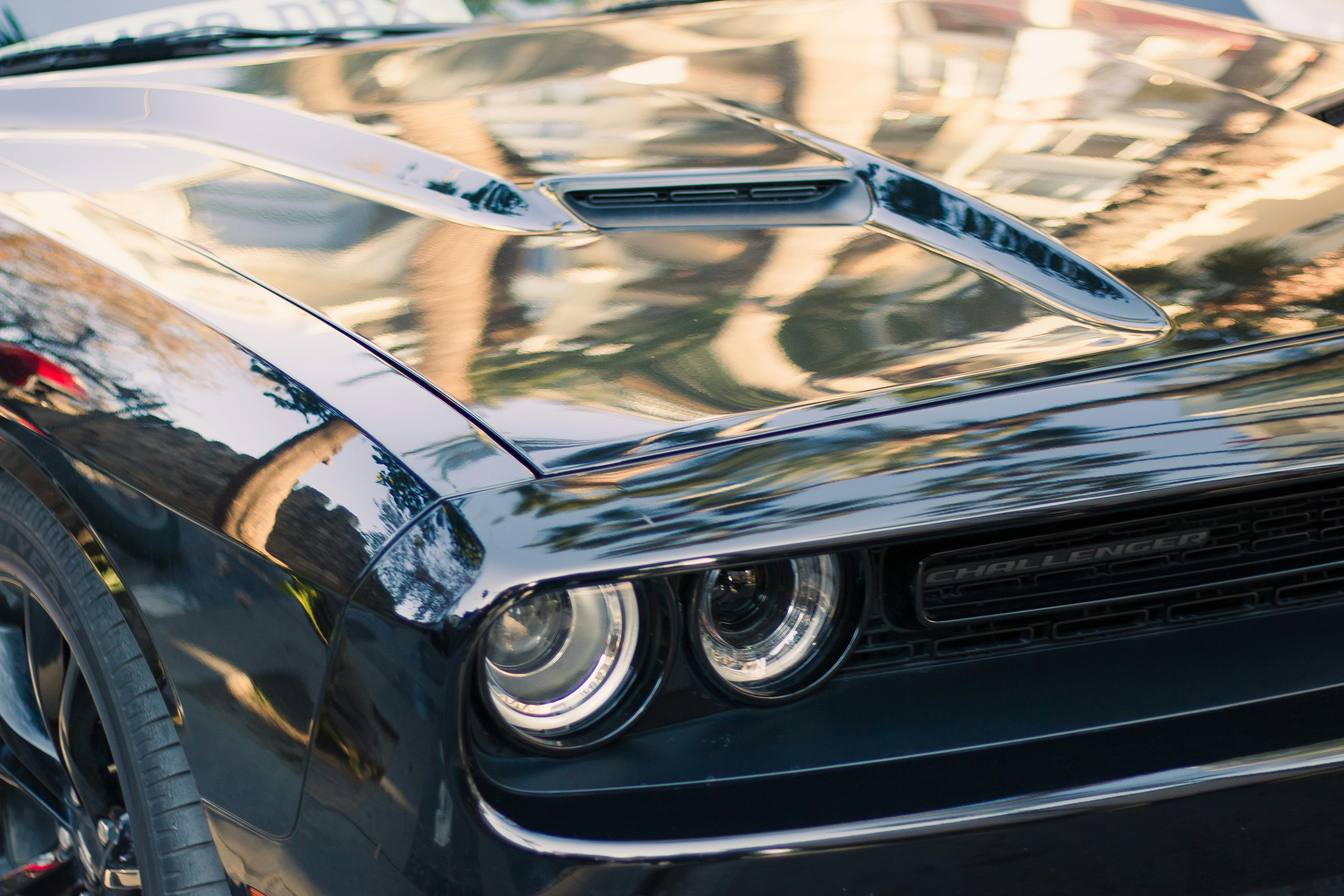a close up of the front of a black sports car