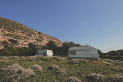 Wide view of parked caravans framed by the rolling green hills of Weardale.