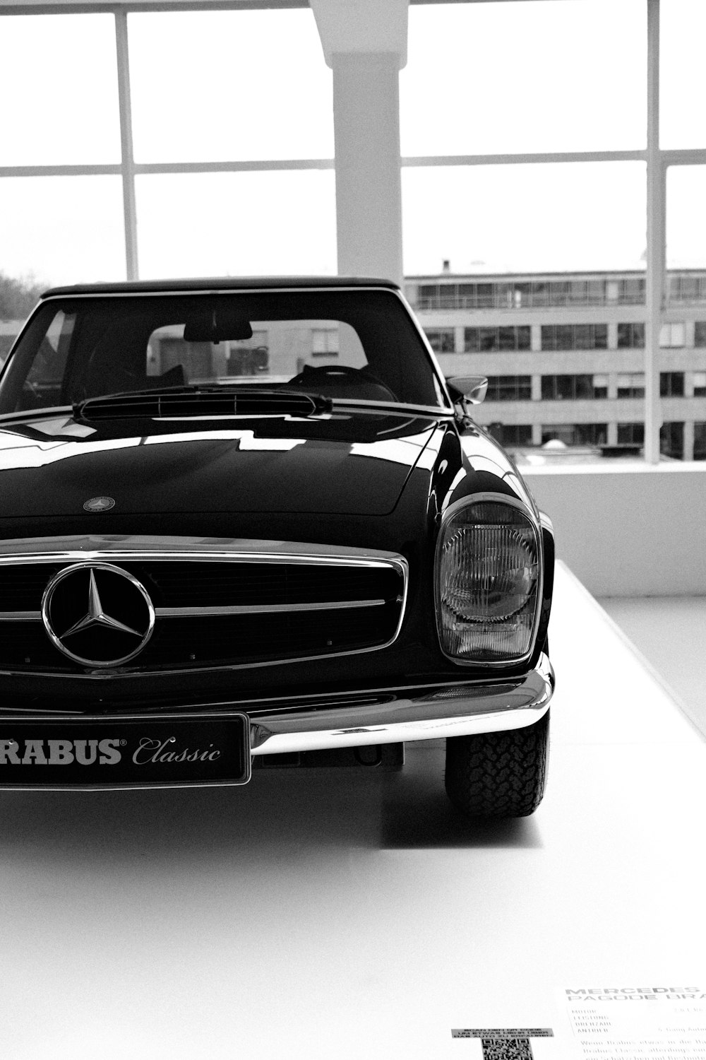 a black and white photo of a mercedes benz