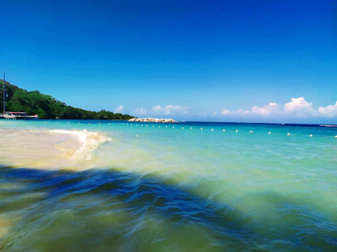 a body of water with a boat in the distance