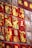 A collection of red envelopes displayed on a wall, featuring golden illustrations of rabbits and Chinese characters. These envelopes are adorned with decorative designs and symbols, likely related to a festival or celebration.