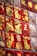 A collection of red envelopes displayed on a wall, featuring golden illustrations of rabbits and Chinese characters. These envelopes are adorned with decorative designs and symbols, likely related to a festival or celebration.