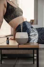 a woman in her underwear is blowing out of a humider