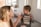 A parent thoughtfully interacting with their child during a game.