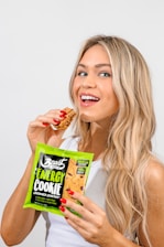 A happy woman enjoying a fit dessert, radiating confidence and health.