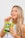 A smiling woman enjoying a pack of Golden Bean dehydrated fruits.