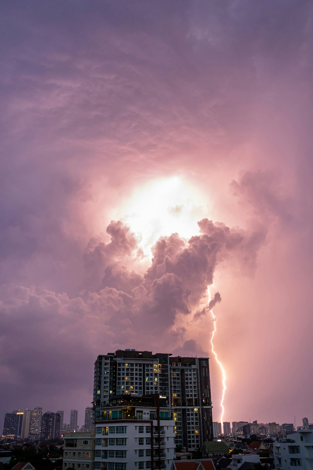 a very tall building under a cloudy sky