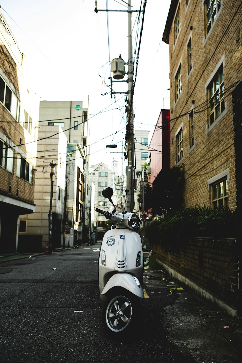 a scooter is parked on the side of the road