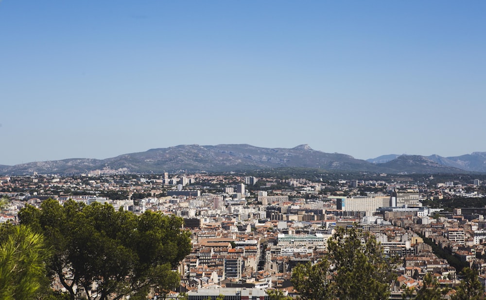 a view of a city with mountains in the background