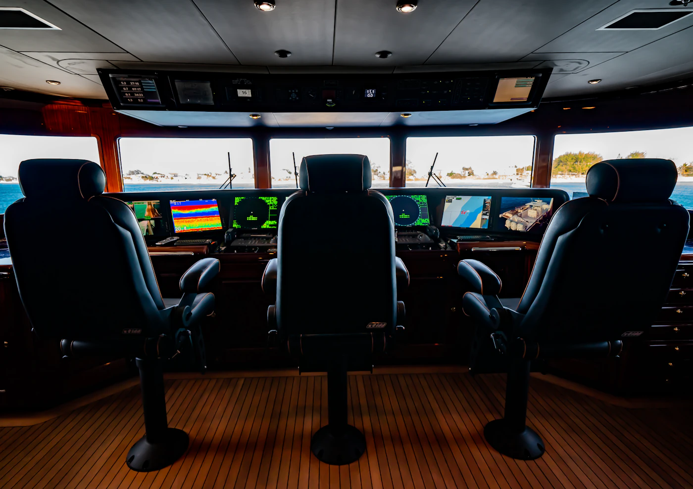 Advanced digital displays and networked systems on the bridge of a luxury yacht