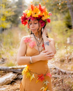 A model wearing various accessories in a natural outdoor setting.
