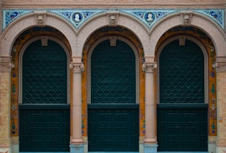 a couple of green doors sitting next to each other