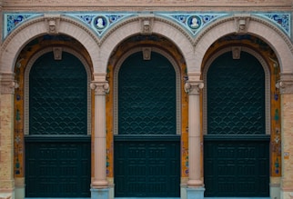 a couple of green doors sitting next to each other