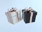 two black and white boxes with gold bows