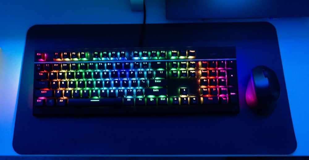 a glowing keyboard and mouse on a desk