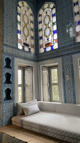 Luxurious Moroccan-style suite with intricate tilework and soft lighting.