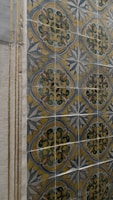 Close-up of luxurious ceramic tiles with intricate patterns.
