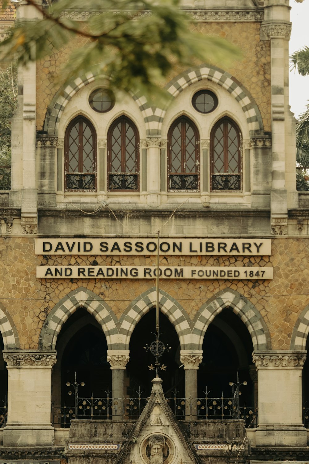 the front of a building with a clock tower