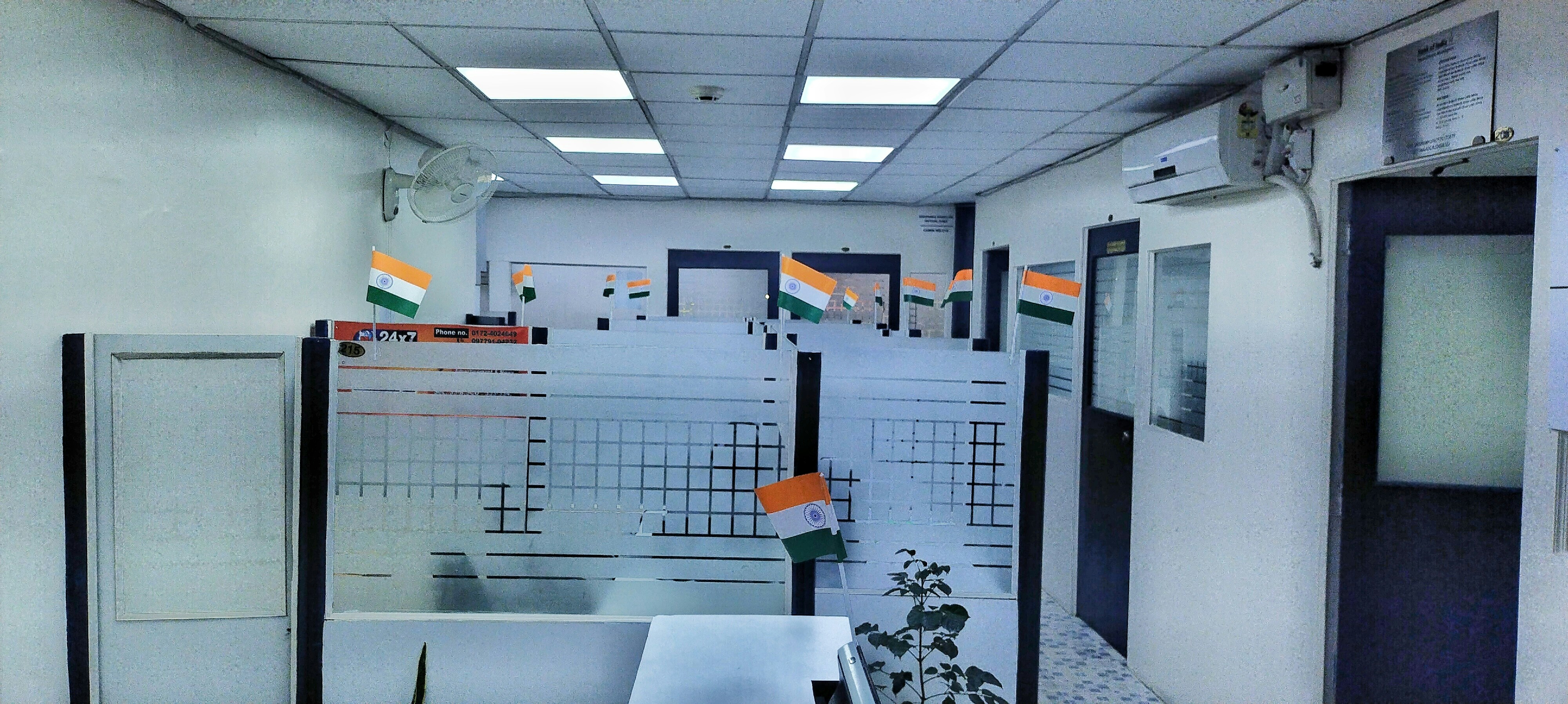 Modern Indian office reception area with water dispenser, bright corporate interior, professional setting