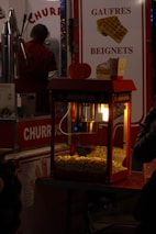 Close-up of concession equipment in use serving guests at a festive gathering.