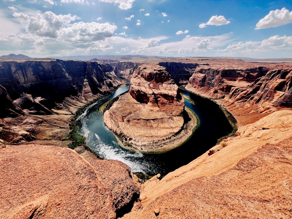 a river running through a canyon surrounded by mountains