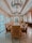 An elegant dining room showcasing handcrafted furniture and refined decor.