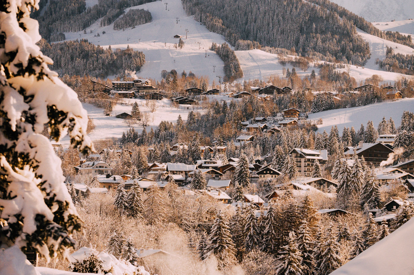 Snow-covered mountainside above an alpine village near Megève