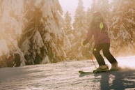 a person riding skis on a snowy surface