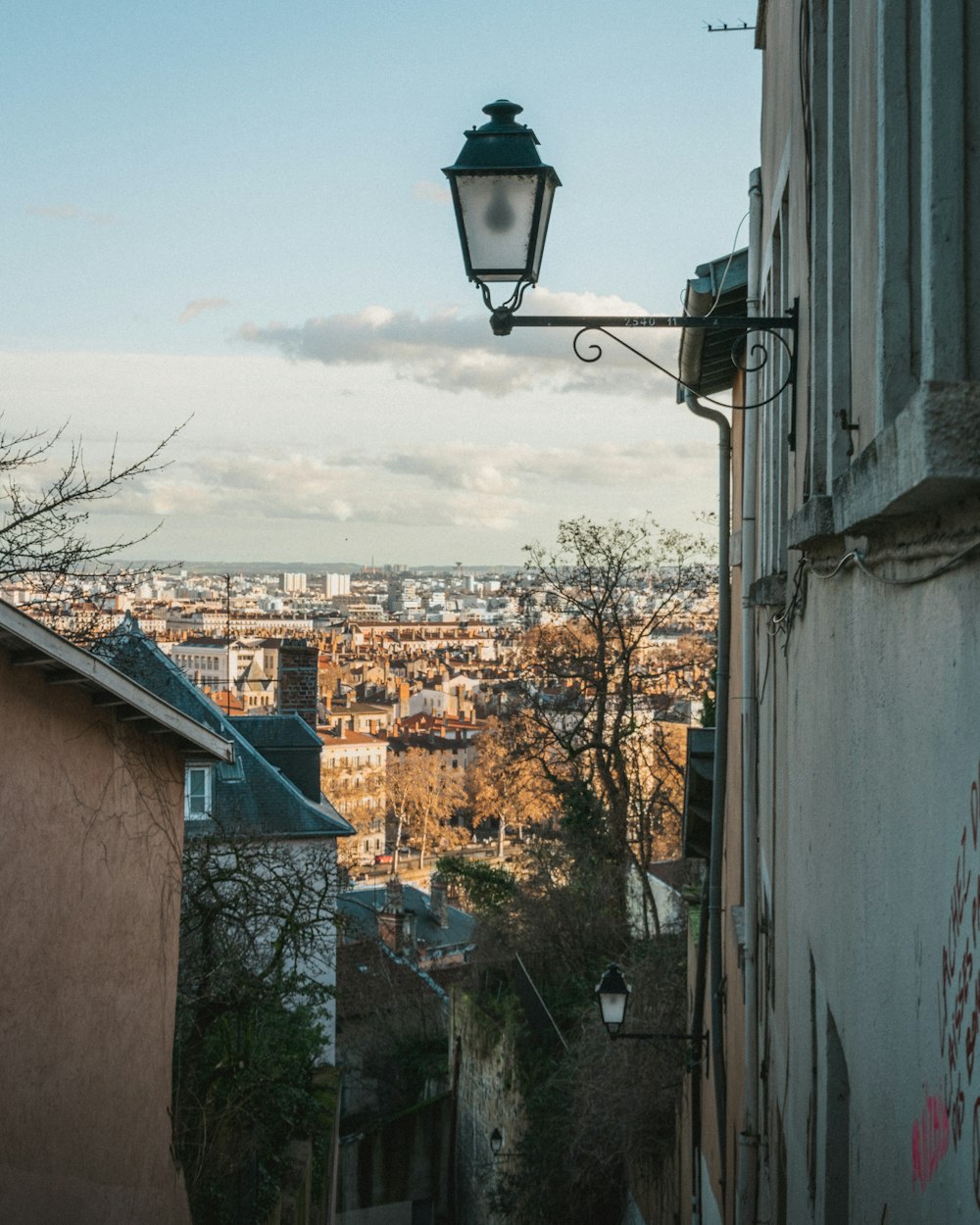 a street light hanging from the side of a building