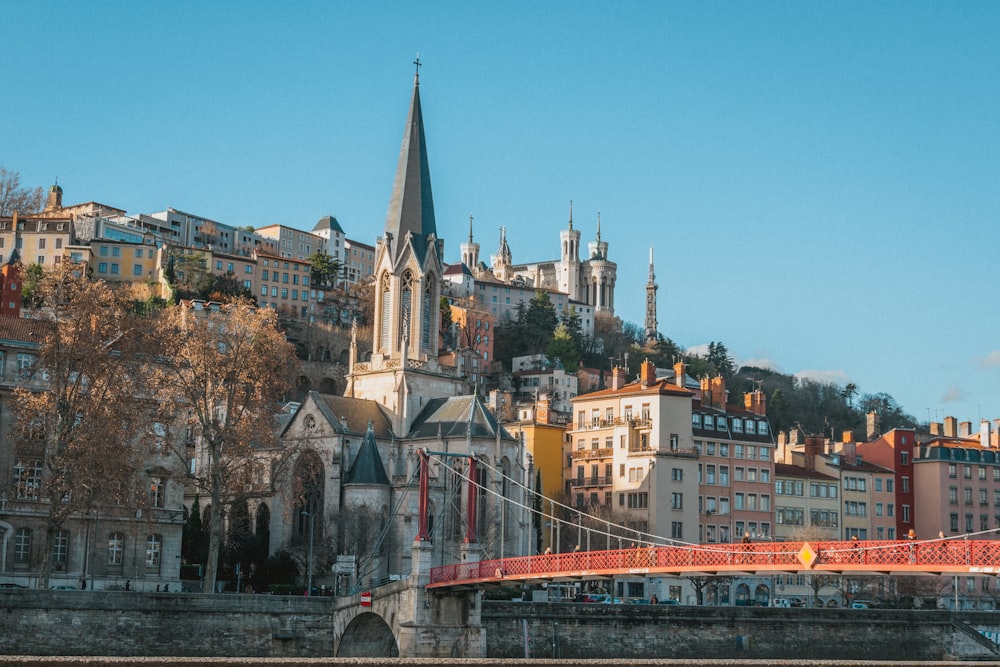 a bridge crossing over a river in front of a city