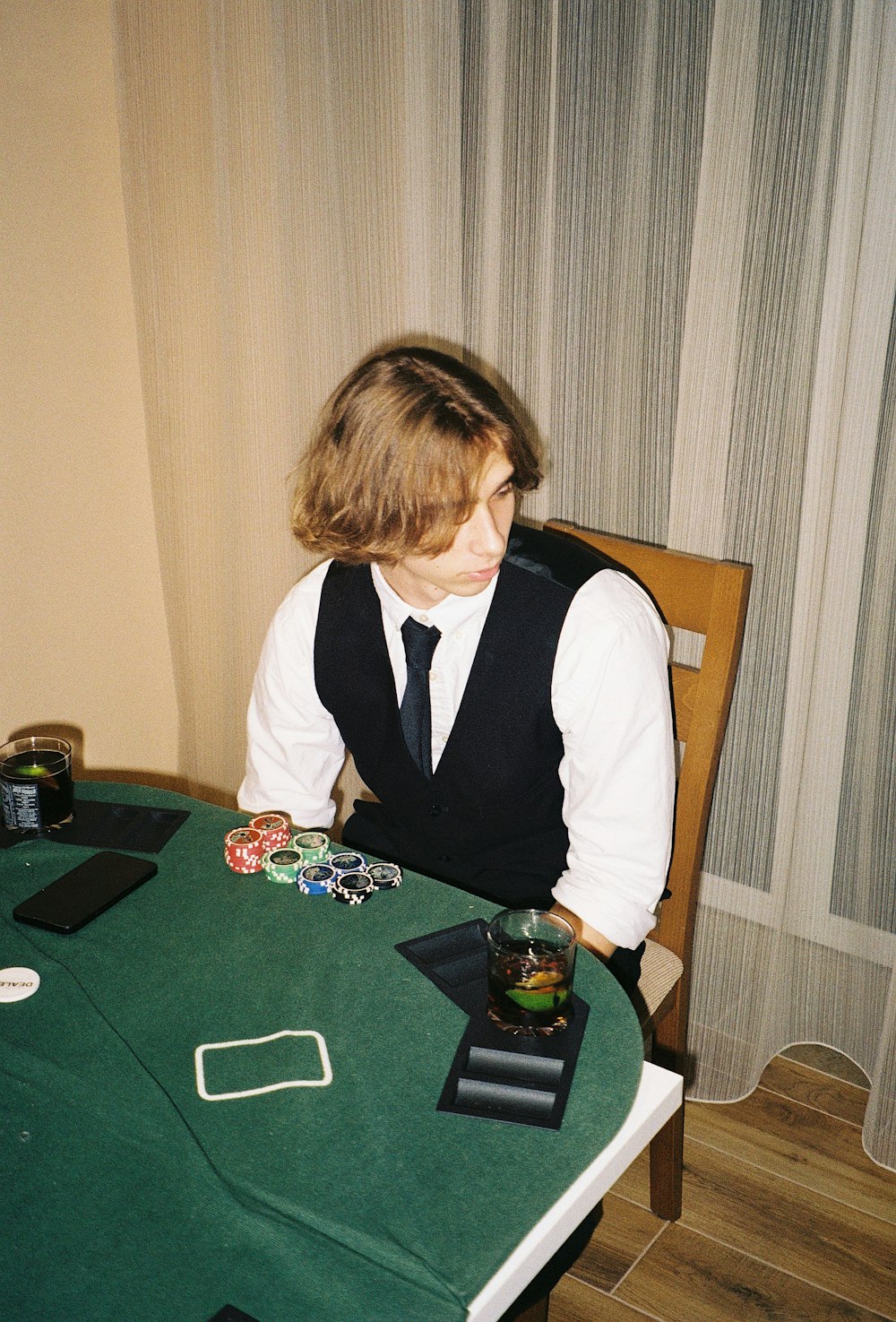 a man sitting at a table with a card in front of him