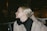 a woman with blond hair wearing a black scarf