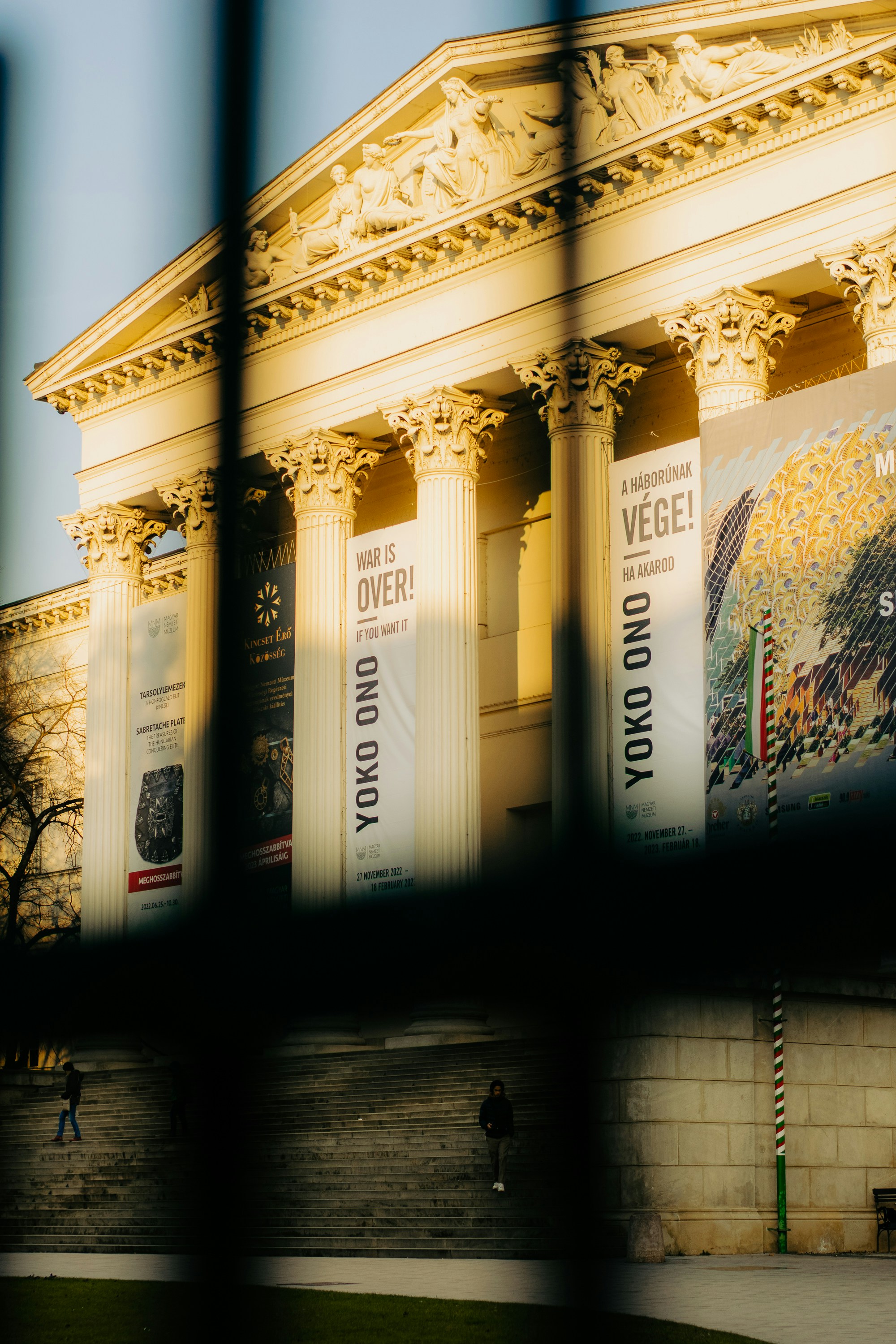 a large building with columns on the side of it
