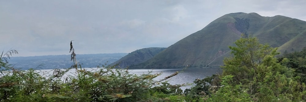 a view of a body of water with mountains in the background