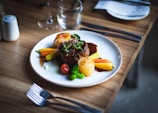 a plate of food on a wooden table