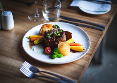 a plate of food on a wooden table