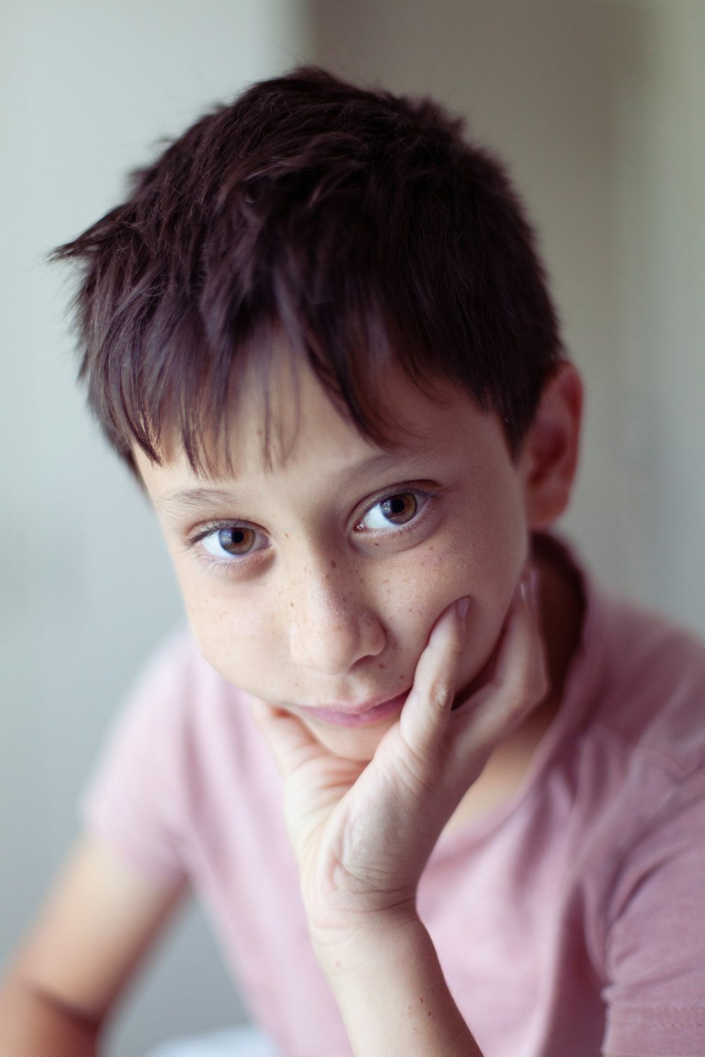 a young boy is posing for a picture