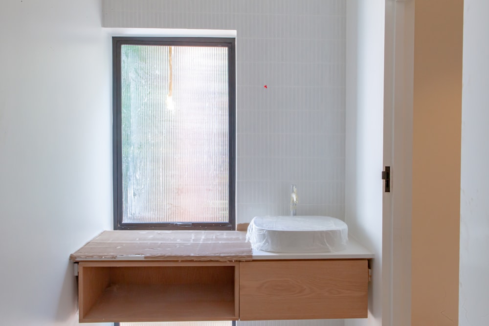 a bathroom with a sink and a window