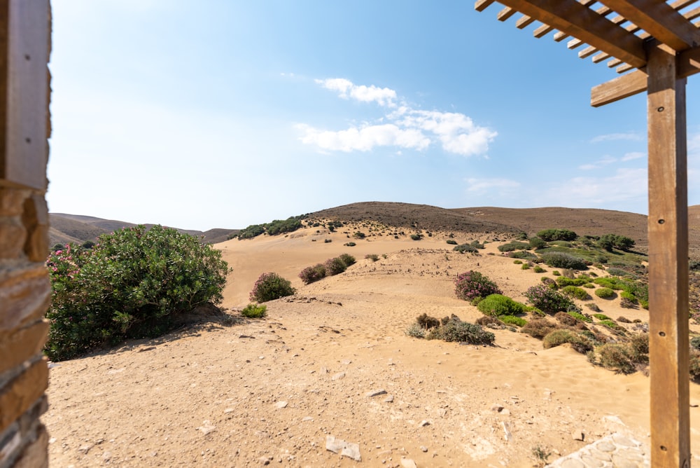 a view of a desert from a wooden structure