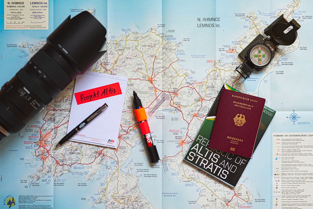 a map, a camera, a passport, a pen and a camera