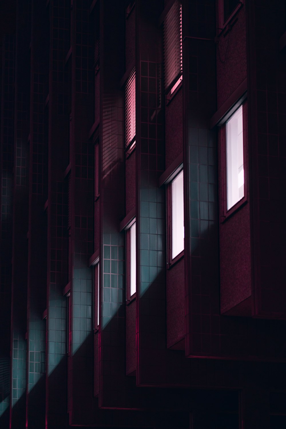a row of windows in a dark building