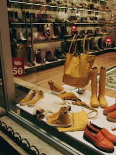 a display case filled with lots of different types of shoes