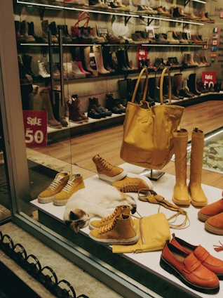 a display case filled with lots of different types of shoes
