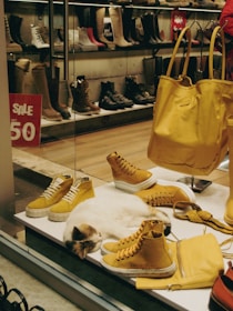 a display of shoes and a cat in a shoe store