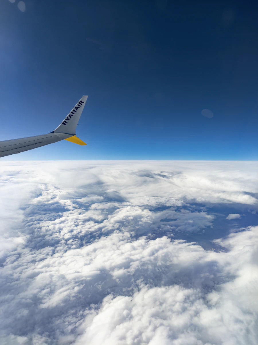 Airplane wing above the clouds
