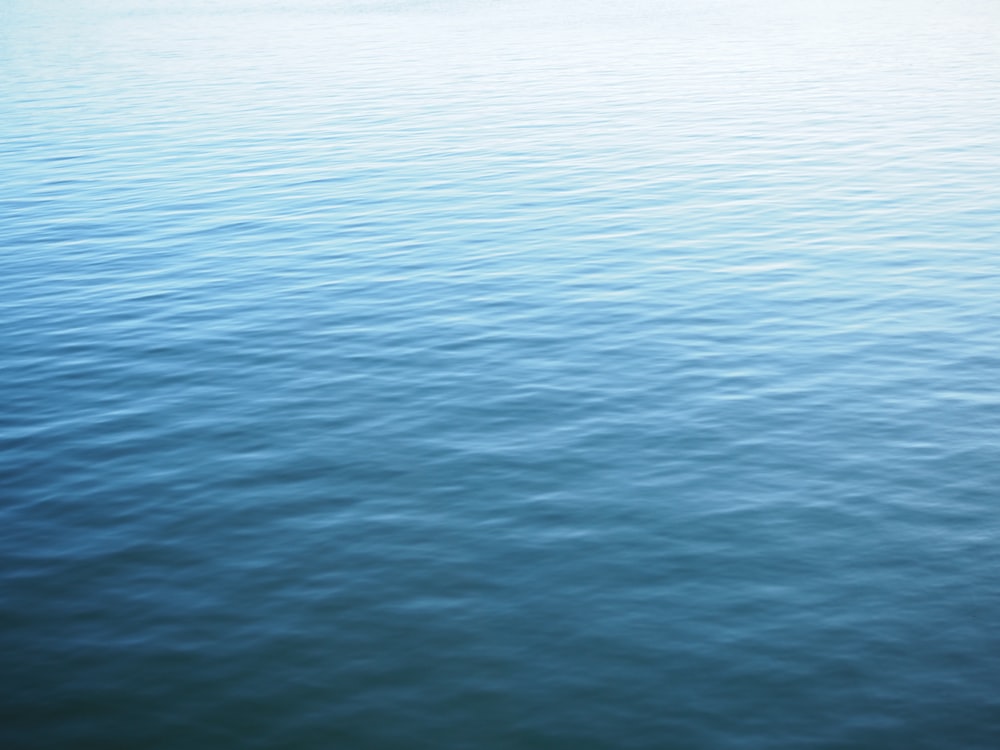 a boat floating on top of a large body of water