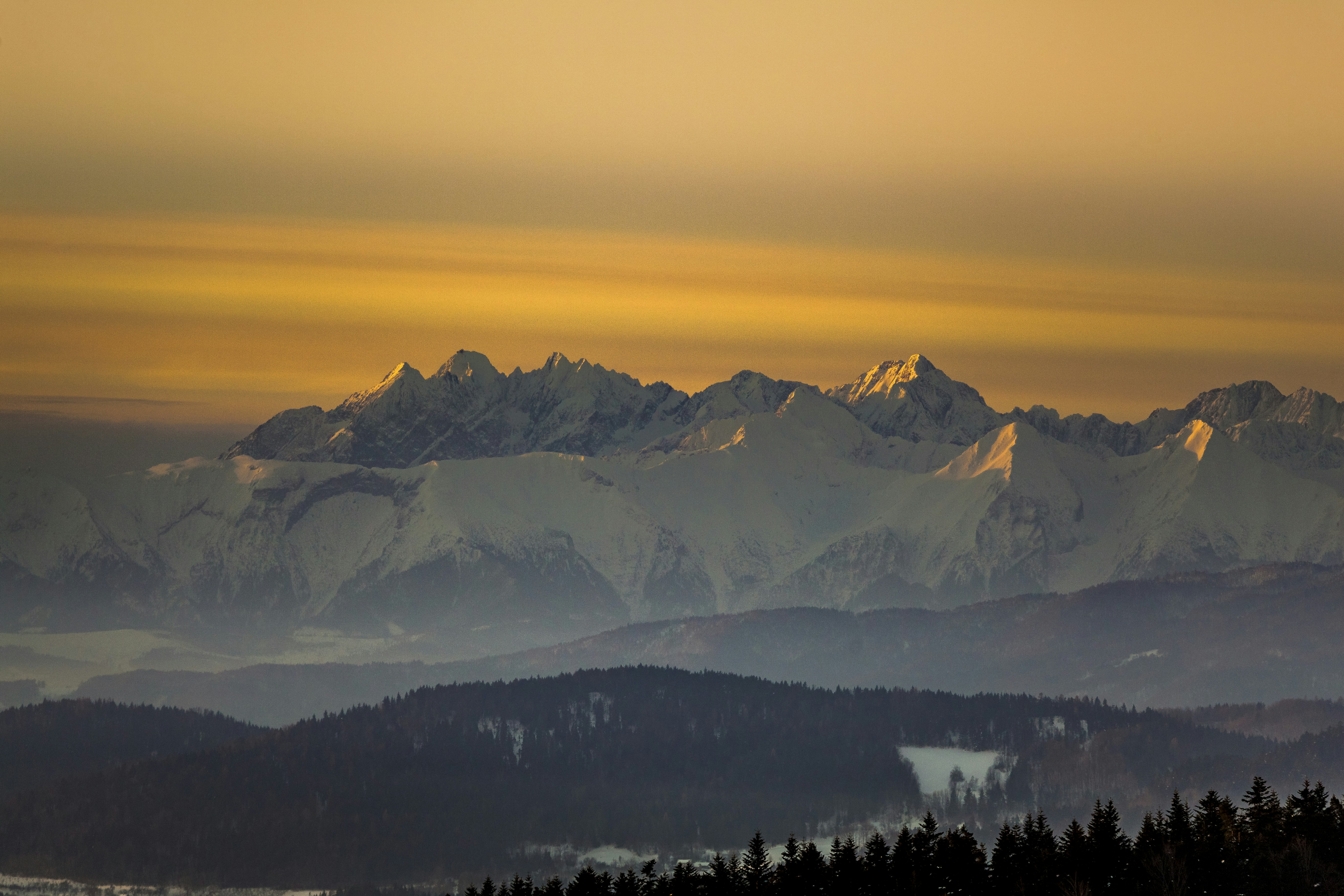 A view of a mountain range at sunset
