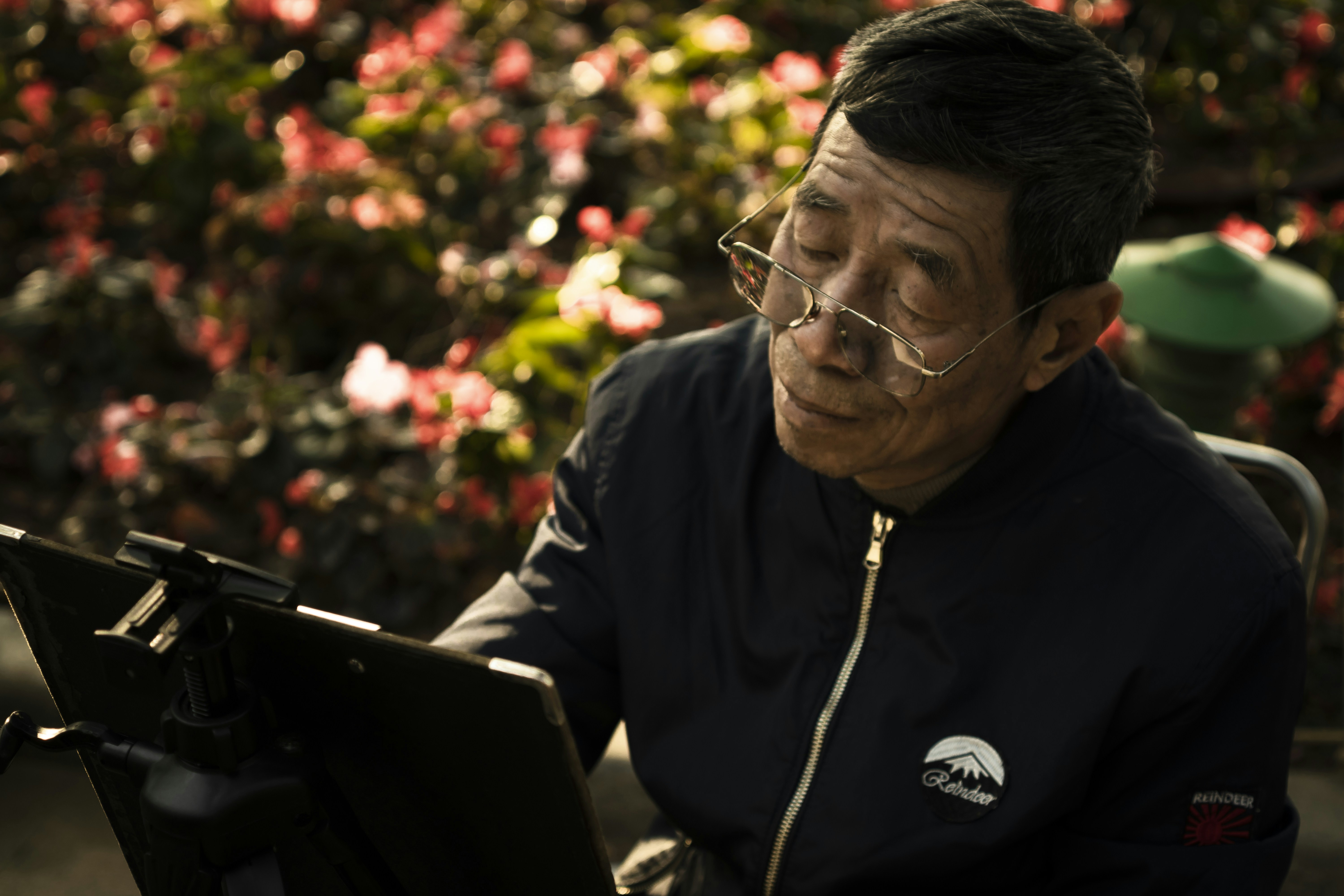 A man sitting in front of a laptop computer