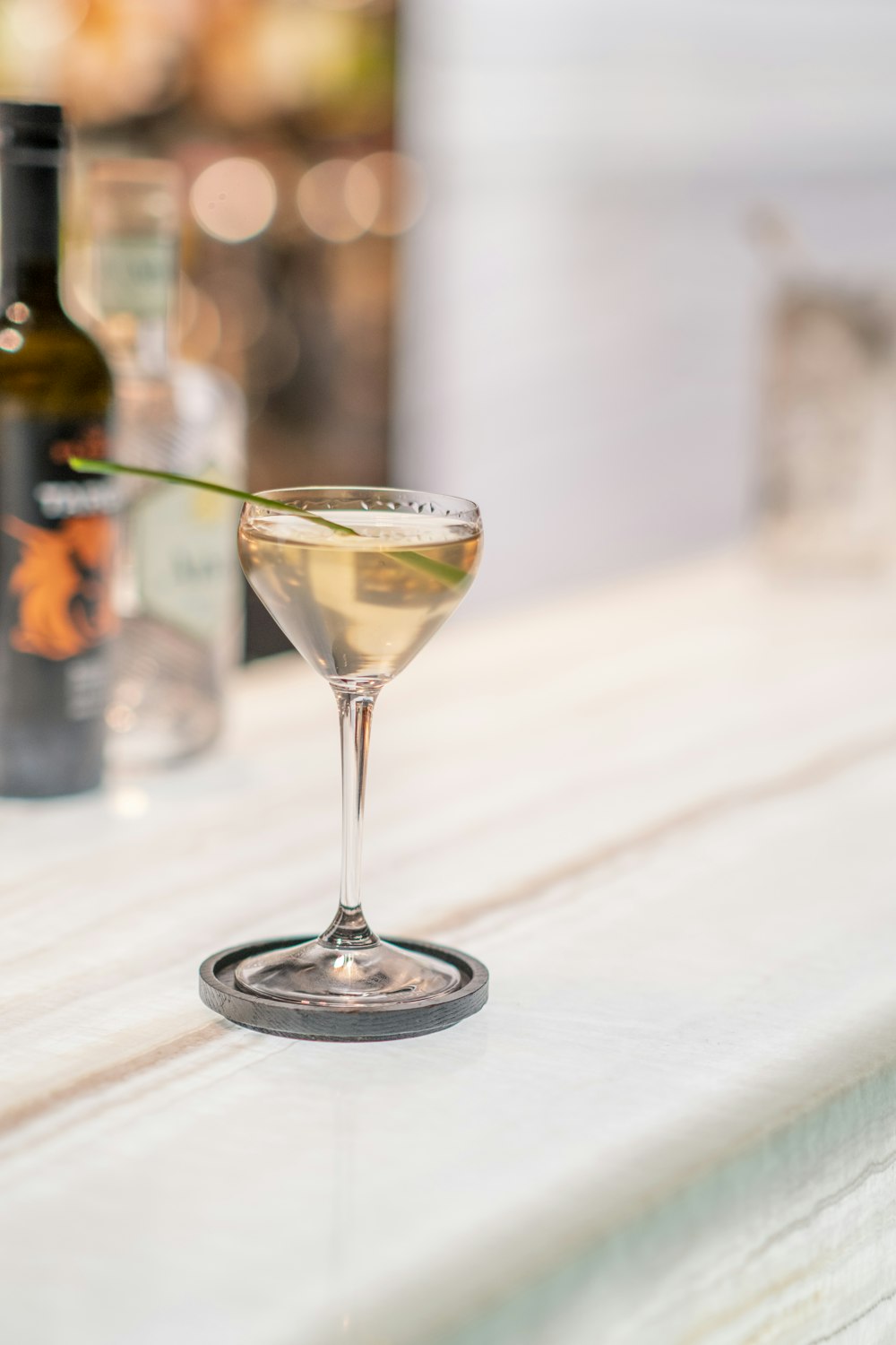 a glass of wine sitting on top of a table