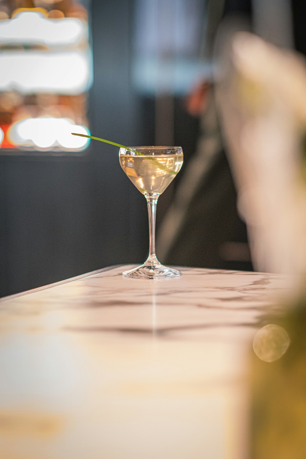 a martini glass sitting on top of a table